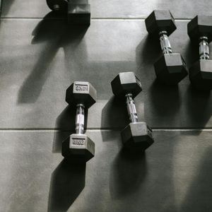 Dumbbells and training gear on the floor.