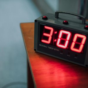 Gym clock and timer showing workout duration.